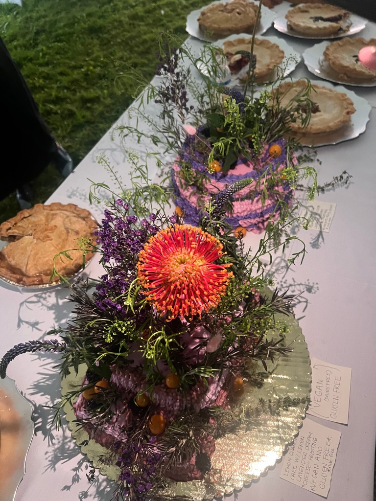 Wedding spread on a table with pies and flowers
